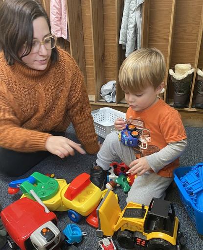 Greyson McKahan, 3, a student at Discovery Christian Dayschool in Coeur d'Alene plays with director Katrina Floyd. ELLI GOLDMAN HILBERT/Press